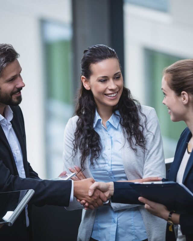 businesspeople-having-discussion-office